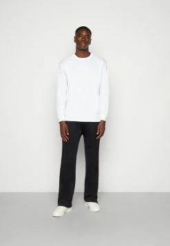 Diesel ZAMPOCK UNISEX - Tracksuit Bottoms - Black -Diesel shop 74cc05df5ba2433e8eb25da10f672014